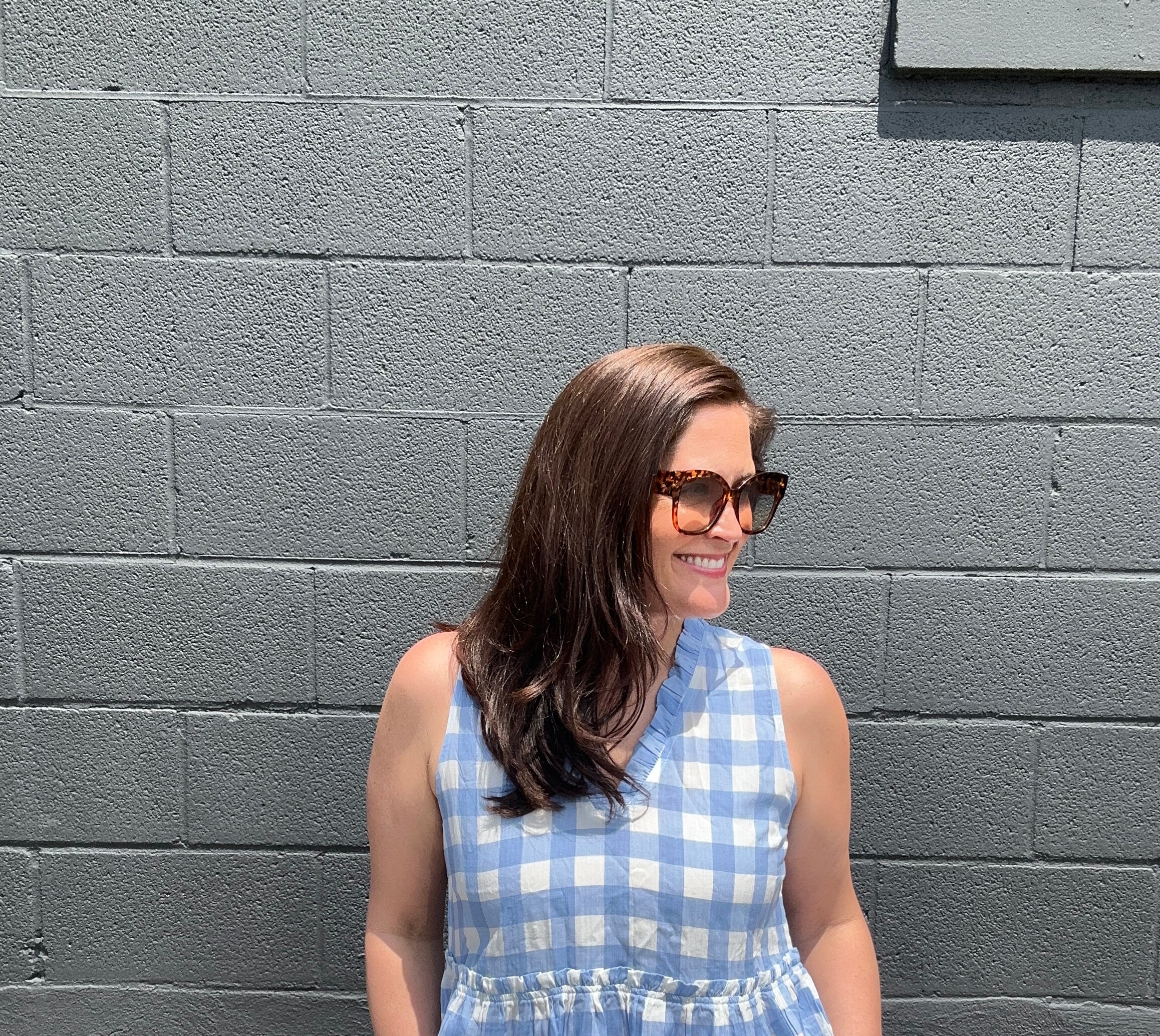blue and white checkered sleeveless v-neck ruffled peplum top
