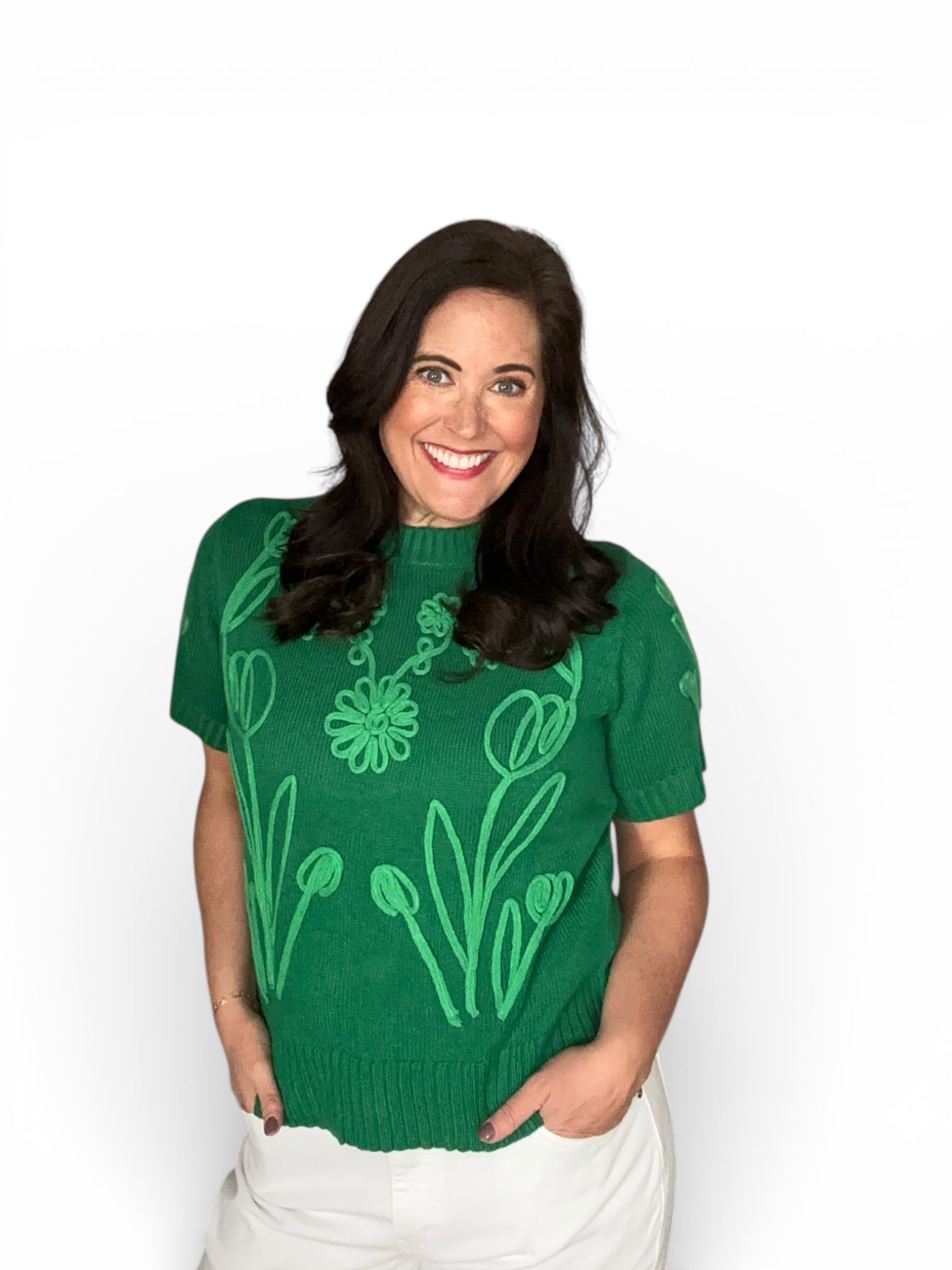 green short sleeve sweater with green embroidered flower detail on front and sleeves