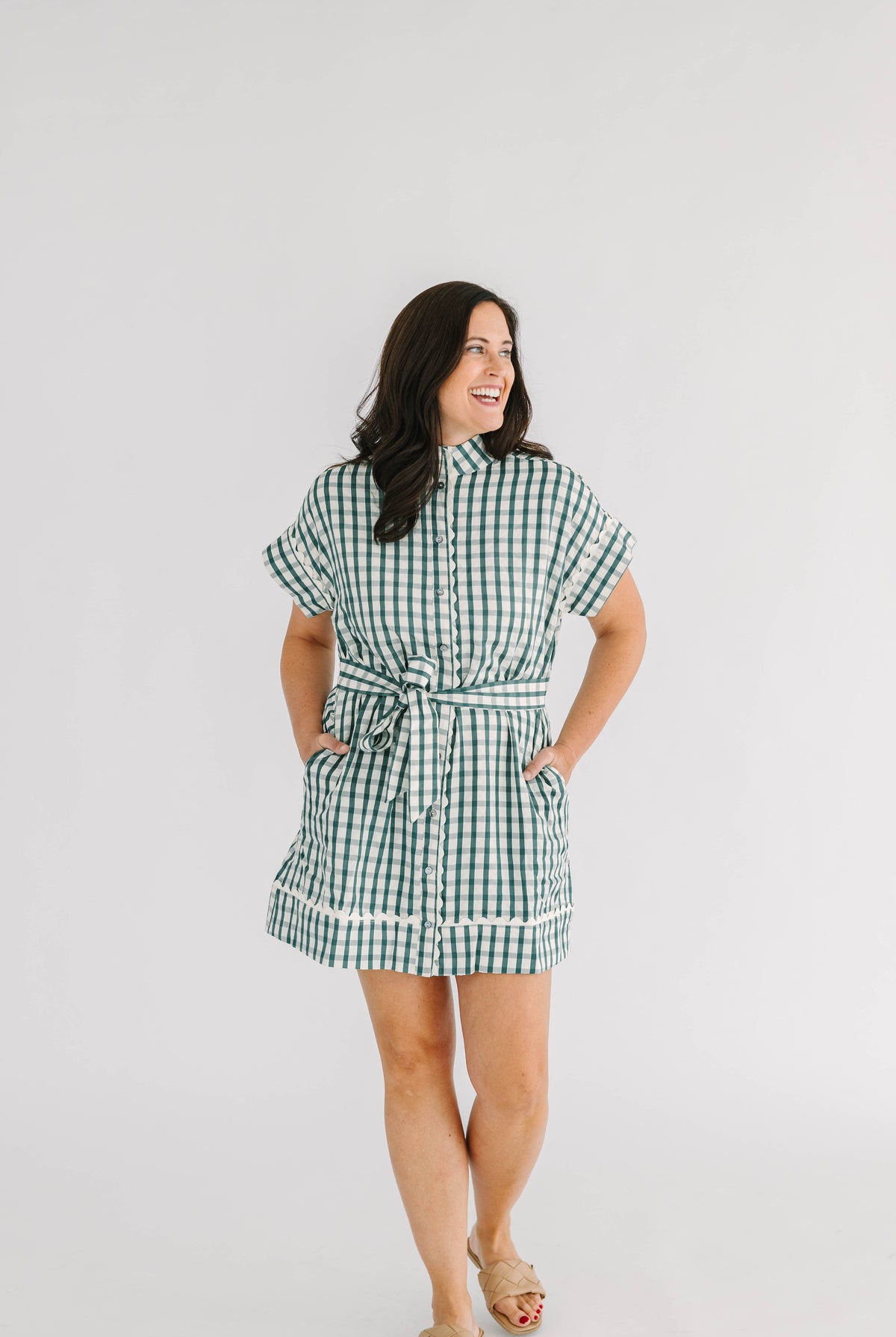 green and white checkered mini dress with button front and tie at waist scallop trim