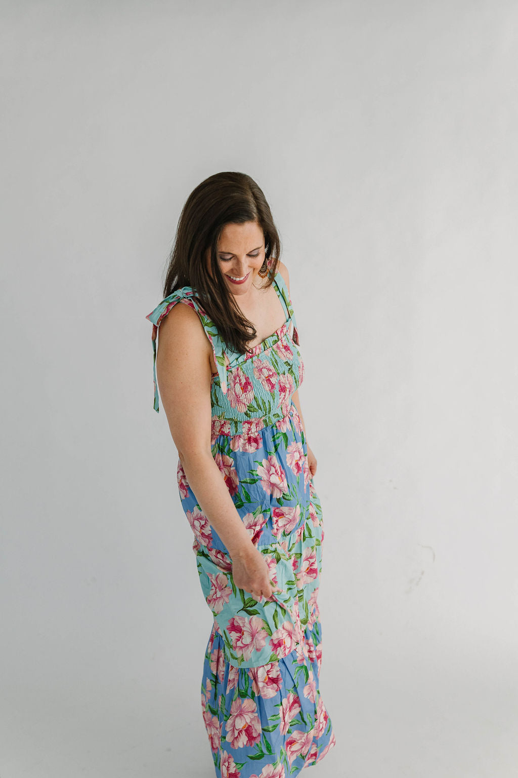 floral maxi dress with self adjustable ties prink flowers on mint and blue background