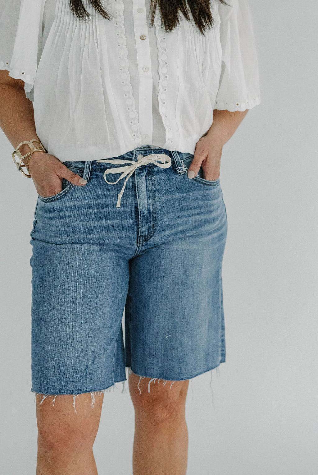 blue denim bermuda shorts with tie detail