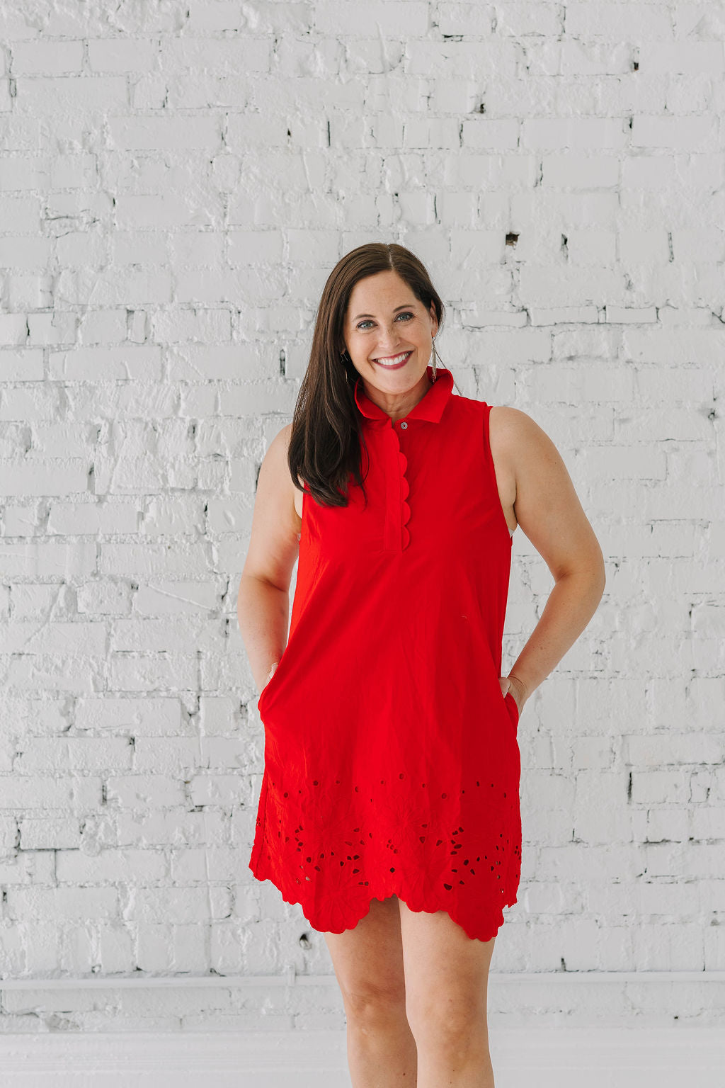 red collar sleeveless dress with eyelet trim and scalloped button detail