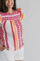 abstract pink and orange flutter short sleeve top