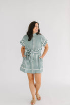 green and white checkered mini dress with button front and tie at waist scallop trim 