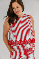 red and white striped top with lace embroidered details 