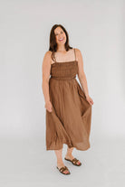 brown midi dress with smocked top and spaghetti straps