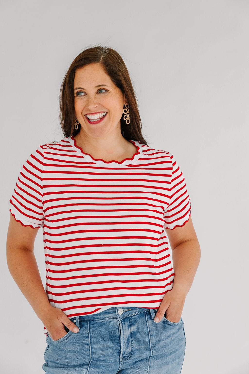  red and white striped short sleeve t-shirt  with scallop detail around neck and arms