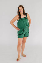 green linen shorts with black trim 
