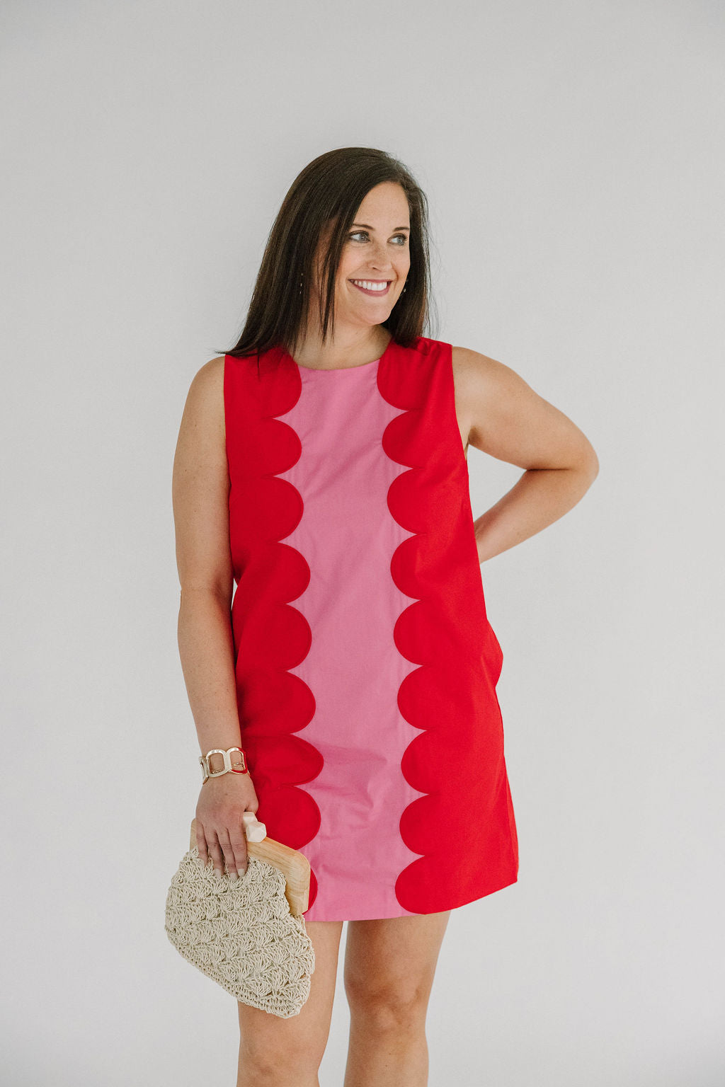  red and pink shift dress with a scalloped edge design 