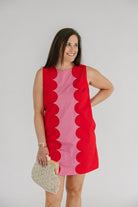  red and pink shift dress with a scalloped edge design 